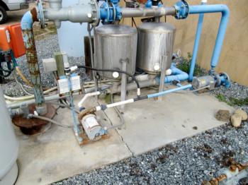 Pump, filters, and injection system for a small drip irrigation system.  Photo: L. Schwankl